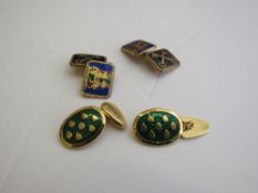 Green enamel & gold coloured cufflinks & an enamel coat of arms cufflinks. Estimate £20-30.