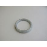 Jade bangle. Estimate £30-40.