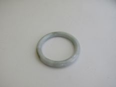 Jade bangle. Estimate £30-40.