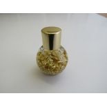 Small jar of 22ct gold leaf. Estimate £20-30.