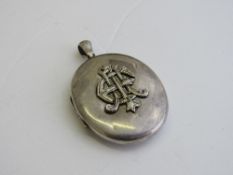 Sterling silver locket with applied monogram to front, 3.5 x 2.25. Estimate £20-30.