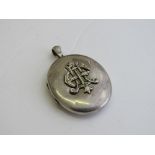 Sterling silver locket with applied monogram to front, 3.5 x 2.25. Estimate £20-30.