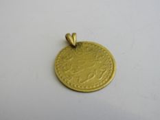 Islamic coin pendant. Estimate £20-30.