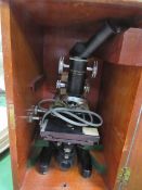 Cooke, Troughton & Simms microscope in a wooden box. Estimate £40-50.