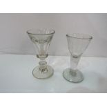 An 18th century illusion glass or Toastmaster's glass & a faceted Georgian toasting glass.