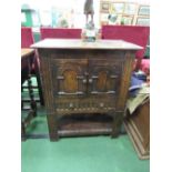 Small oak cupboard over drawer with under shelf, 67cms x 40cms x 81cms. Estimate £40-60.