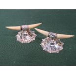 Pair of early 20th century sterling silver knife rests, in the shape of cows' horns. Estimate £30-