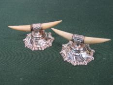 Pair of early 20th century sterling silver knife rests, in the shape of cows' horns. Estimate £30-