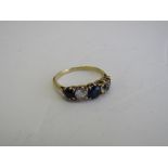 9ct gold (tested) blue & white stone ring, size K. Estimate £40-60.