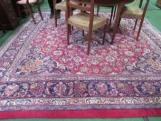 Inraman made red ground carpet, 290 x 290. Estimate £50-80.