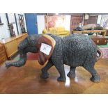 Carved wood African elephant (no tusks), height 27.5cms, length 51cms. Estimate £20-30.