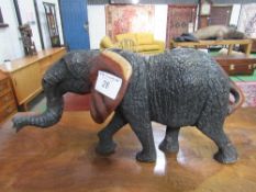 Carved wood African elephant (no tusks), height 27.5cms, length 51cms. Estimate £20-30.