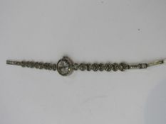 925 silver cased marcasite encrusted cocktail watch. Estimate £20-40.