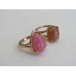2 gold overlay on silver rings with pink stone & brown stone, size P & R. Estimate £25-35.