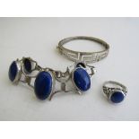 Silver & blue stone bracelet with matching ring & a silver bangle. Estimate £20-30.