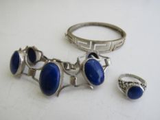 Silver & blue stone bracelet with matching ring & a silver bangle. Estimate £20-30.