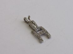 White metal diamond set 'H' pendant, length 2.5mm. Estimate £40-60.