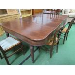 Edwardian extendable mahogany dining table on tapered fluted legs to brass castors, 180cms (