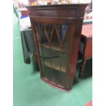 Modern wall mounted glazed door corner cabinet. Estimate £10-20.