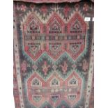 Persian rug with Aztec design, 2.2m x 118cms. Estimate £20-30.