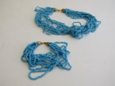 Turquoise coral type necklace & bracelet. Estimate £20-30.