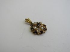 9ct gold, pearl & garnet floral pendant. Estimate £50-60.