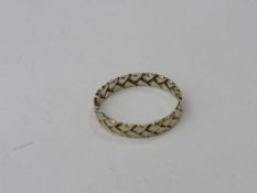 10ct gold decorated wedding band, size P, weight 1.6gms. Estimate £40-50.