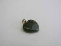 Heart-shaped jade pendant. Estimate £20-30.