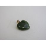 Heart-shaped jade pendant. Estimate £20-30.