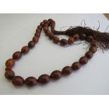 Vintage carved horn bead necklace. Estimate £70-80.