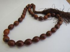 Vintage carved horn bead necklace. Estimate £70-80.
