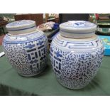 2 large blue & white ginger jars. Estimate £20-40.