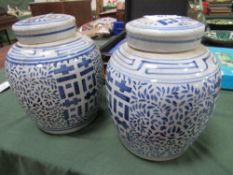 2 large blue & white ginger jars. Estimate £20-40.