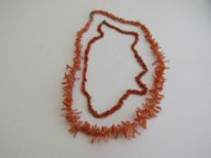 2 angel skin coral necklaces. Estimate £20-30.