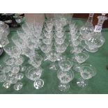 Large qty of cut glass drinking glasses together with 2 decanters. Estimate £20-30.
