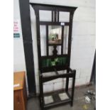 Ebonised hall stand with tiles & mirror to back, 61cms x 26cms x 182cms.