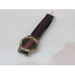 Gucci quartz gold plated wristwatch with colour coded strap, good working order. Estimate £15-20.