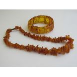 Amber bracelet & a butterscotch amber necklace. Estimate £40-50.
