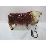 Melba ware Hereford bull & tether. Estimate £20-30.