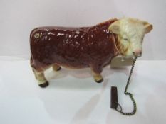 Melba ware Hereford bull & tether. Estimate £20-30.