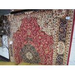 Red ground Keshan carpet, 2.8 x 2.0m. Estimate £50-60.