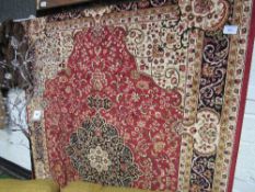 Red ground Keshan carpet, 2.8 x 2.0m. Estimate £50-60.