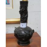 Tall heavy solid bronze Japanese Meiji bottle shape vase with embossed designs & applied dragon