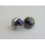 Pair of white metal, black pearl & diamond earrings. Estimate £30-40.