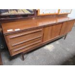 1970's mahogany G-Plan style sideboard with 3 drawers & 2 sliding doors, 194cms x 44cms x 73cms.