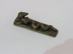Rare 19th century Ashanti bronze snake attacking snake gold weight. Estimate £30-50.