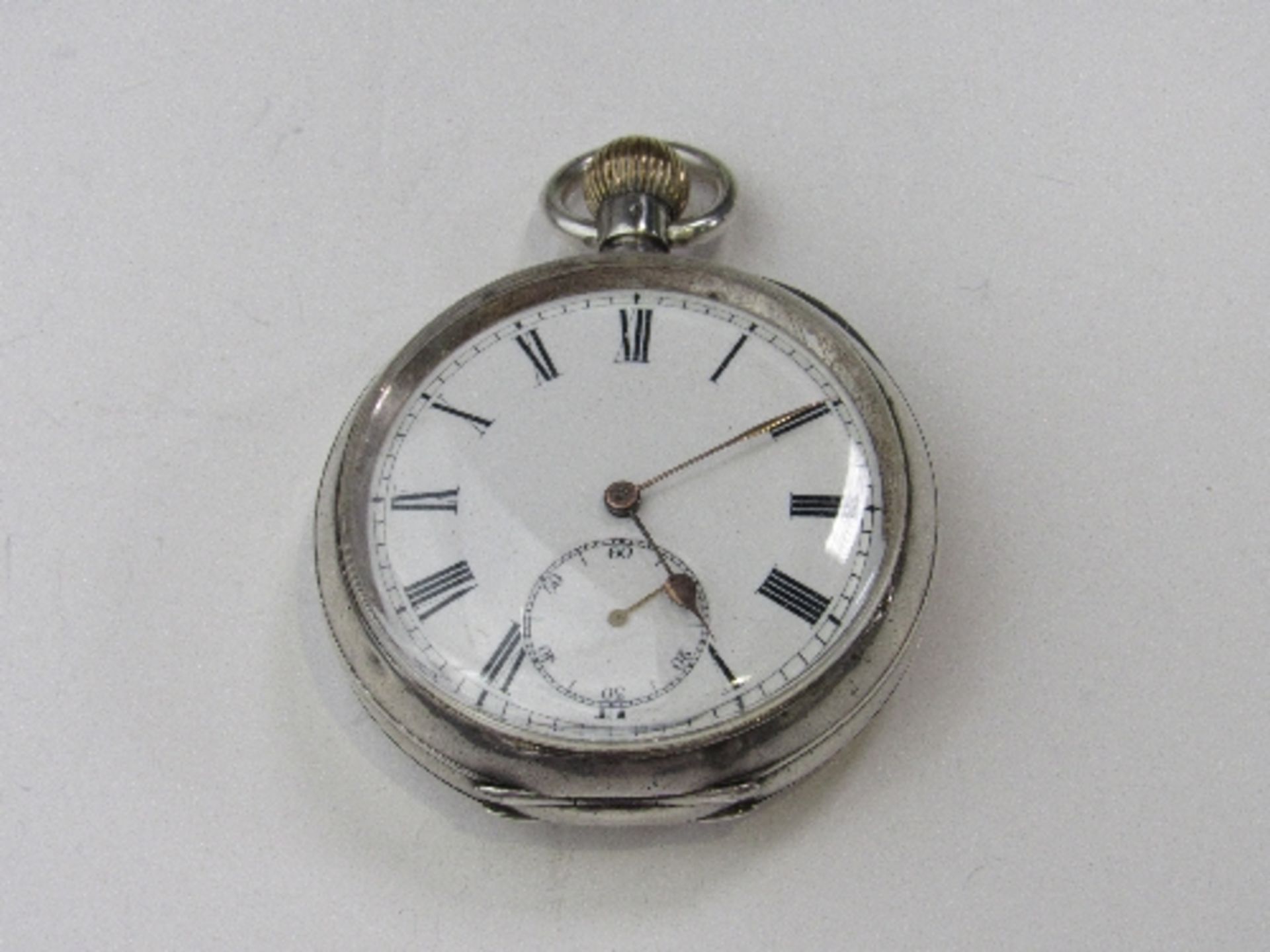 935 silver Swiss made pocket watch with white face & Roman numerals. Estimate £35-50.