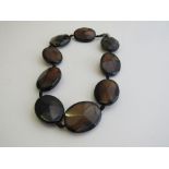 9 large agate stone necklace. Estimate £40-60.