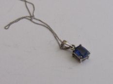 18ct white gold & natural sapphire pendant on white metal chain, length 22cm. Estimate £150-180.