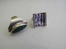 Silver & green stone ring & a silver & clear stone ring. Estimate £10-20.